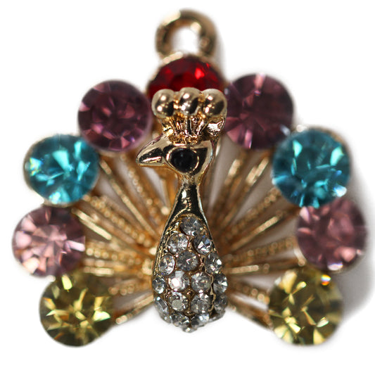 Peacock gold alloy encrusted multicoloured diamante cabochon